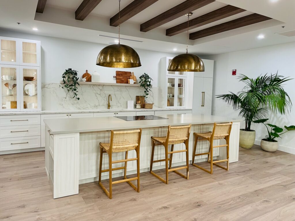 Laminate floors in an open island kitchen by Carpet to Go in Bellevue, WA.